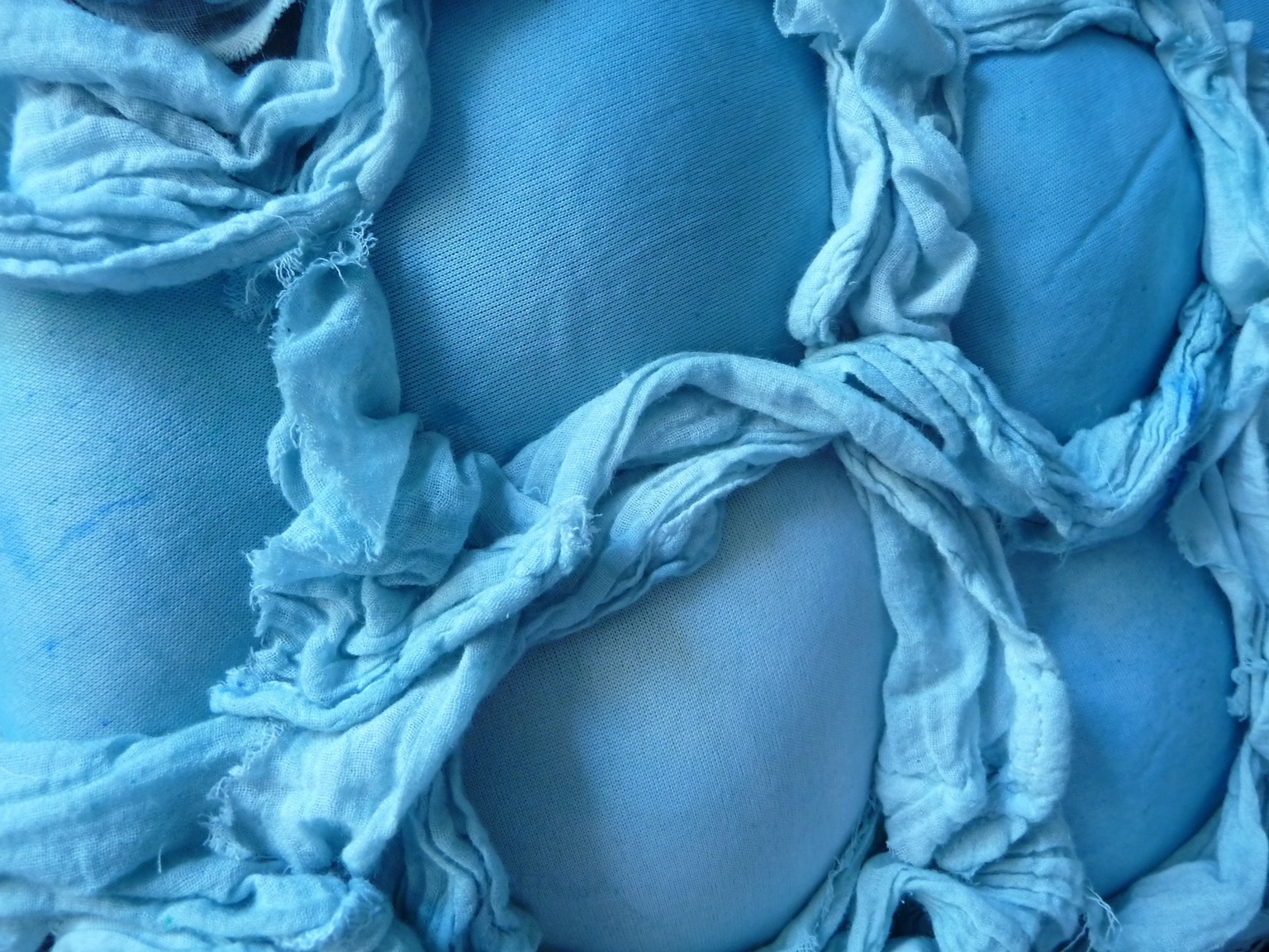 image of super8mm film with blue salt and ink stains